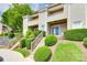 Charming condo featuring a private balcony and well-maintained landscaping with verdant shrubbery and inviting staircases at 14053 Queens Harbor Rd, Charlotte, NC 28278
