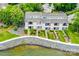 Aerial view of townhomes with well-maintained landscaping and waterfront access, offering beautiful lakeside living at 14053 Queens Harbor Rd, Charlotte, NC 28278