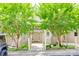 Charming townhome exterior with mature trees, a welcoming entrance, and well-maintained landscaping at 14053 Queens Harbor Rd, Charlotte, NC 28278