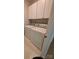 Laundry room with white cabinets and a side-by-side washer and dryer at 14053 Queens Harbor Rd, Charlotte, NC 28278