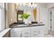 Bathroom with double sink, modern fixtures and large mirror at 15906 Parkside Crossing Dr # 317, Charlotte, NC 28273