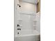 Clean white tub and shower with black hardware fixtures at 15906 Parkside Crossing Dr # 317, Charlotte, NC 28273