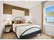 Cozy bedroom with a comfortable bed, soft lighting, and a soothing color scheme at 15906 Parkside Crossing Dr # 317, Charlotte, NC 28273