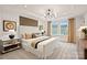 Bedroom with white molding, tray ceiling, and earth tone décor at 15906 Parkside Crossing Dr # 317, Charlotte, NC 28273