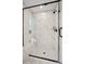 Glass enclosed shower with white marble tile and bench at 15906 Parkside Crossing Dr # 317, Charlotte, NC 28273