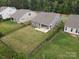 Aerial view of a fenced backyard and covered porch at 16112 Langston Dr, Charlotte, NC 28278