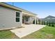 Covered back porch with stained concrete and a porch swing at 16112 Langston Dr, Charlotte, NC 28278