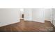 View of bedroom with wood floor and doorway to walk-in closet at 16112 Langston Dr, Charlotte, NC 28278