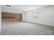 Bright bedroom with a brick accent wall and large window for natural light at 16112 Langston Dr, Charlotte, NC 28278