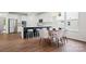 Spacious open-concept kitchen and dining area with modern finishes and ample seating for Gathering and guests at 16112 Langston Dr, Charlotte, NC 28278