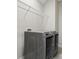 Laundry room with large washer and dryer and wire shelving at 16112 Langston Dr, Charlotte, NC 28278