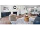 Well-lit living room featuring a fireplace, modern furnishings, and an open layout perfect for entertaining at 16112 Langston Dr, Charlotte, NC 28278