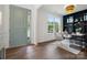 Bright living room with elegant gray chairs, a large window and a decorative black bookcase at 16112 Langston Dr, Charlotte, NC 28278