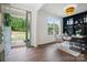 Bright living room with elegant gray chairs, a large window and a decorative black bookcase at 16112 Langston Dr, Charlotte, NC 28278