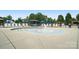Community splash pad with surrounding lounge chairs, ideal for Gathering fun at 16112 Langston Dr, Charlotte, NC 28278