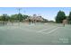 Well-maintained tennis court ready for a match, set within a beautiful community at 16112 Langston Dr, Charlotte, NC 28278