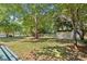 Spacious backyard featuring a storage shed and ample green space, offering privacy and room for outdoor activities at 1624 Moonstone Dr, Matthews, NC 28105