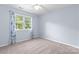 Comfortable bedroom with a large window and light blue accent wall at 1624 Moonstone Dr, Matthews, NC 28105
