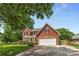 Traditional two-story red brick home with a two-car garage and well-maintained landscaping at 1624 Moonstone Dr, Matthews, NC 28105