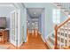 Spacious foyer with hardwood floors, staircase, and natural light creates a welcoming entrance at 1624 Moonstone Dr, Matthews, NC 28105