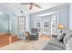 Bright living room featuring a bay window, comfortable seating, and hardwood floors at 1624 Moonstone Dr, Matthews, NC 28105