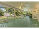 Inviting outdoor porch featuring ceiling fans, string lights, and a spacious area for relaxation and entertaining at 1624 Moonstone Dr, Matthews, NC 28105