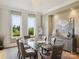 Sophisticated dining room with large windows, stylish decor, a modern table, and comfortable seating at 172 Barber Loop, Mooresville, NC 28117