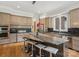 Spacious kitchen with an oversized island, custom cabinetry, granite countertops, and modern stainless steel appliances at 172 Barber Loop, Mooresville, NC 28117