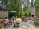 Expansive outdoor patio with a grilling area, firepit, and ample seating, perfect for relaxation at 172 Barber Loop, Mooresville, NC 28117