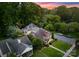Aerial view of a home surrounded by lush greenery and mature trees at 2100 Chesterfield Ave, Charlotte, NC 28205