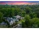 Stunning aerial view showcasing lush greenery, beautiful homes, and the city skyline in the distance at 2100 Chesterfield Ave, Charlotte, NC 28205
