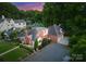 High-angle view of a beautiful house with well-manicured lawn, mature trees and inviting driveway at 2100 Chesterfield Ave, Charlotte, NC 28205