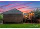 A cozy brick home with an outdoor deck area, perfect for enjoying the evening sunset at 2100 Chesterfield Ave, Charlotte, NC 28205