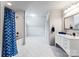 Bright bathroom featuring modern fixtures, a shower-tub combo, and sleek vanity with marble floors at 2100 Chesterfield Ave, Charlotte, NC 28205