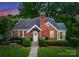 Charming brick home with a well-manicured lawn and mature trees at 2100 Chesterfield Ave, Charlotte, NC 28205