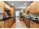 Spacious kitchen with wooden cabinets, granite countertops and stainless steel appliances at 2100 Chesterfield Ave, Charlotte, NC 28205