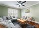 Inviting living room with a ceiling fan, a sectional sofa, and natural light at 2100 Chesterfield Ave, Charlotte, NC 28205