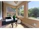 Bright sunroom featuring many windows providing ample sunlight, and comfortable seating perfect for relaxation at 2100 Chesterfield Ave, Charlotte, NC 28205