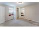 Cozy bedroom with carpet floors, natural light, and a closet for storage at 2105 Florida Ave, Kannapolis, NC 28083