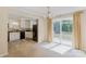 Dining area and kitchen featuring white cabinetry and sliding glass doors to the backyard at 2105 Florida Ave, Kannapolis, NC 28083