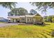 Charming single-story home with a well-manicured front lawn, carport, and inviting entrance at 2105 Florida Ave, Kannapolis, NC 28083