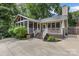 Private backyard with a screened porch, a deck, and a concrete patio perfect for entertaining at 2112 Shenandoah Ave, Charlotte, NC 28205