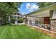 Great backyard with outdoor seating, a covered area and a screened in porch. Ready for summer at 2112 Shenandoah Ave, Charlotte, NC 28205
