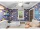 Bright bedroom featuring colorful wallpaper, natural light, and ceiling fan at 2112 Shenandoah Ave, Charlotte, NC 28205
