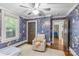 Bedroom featuring colorful wallpaper, ceiling fan, and natural light at 2112 Shenandoah Ave, Charlotte, NC 28205