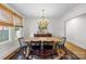 Bright dining room featuring a chandelier, buffet, and large windows at 2112 Shenandoah Ave, Charlotte, NC 28205