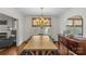 Charming dining room featuring a chandelier, buffet, and natural light at 2112 Shenandoah Ave, Charlotte, NC 28205