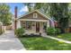 Charming craftsman-style home with a landscaped front yard, inviting porch, and a classic brick chimney at 2112 Shenandoah Ave, Charlotte, NC 28205