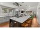 Spacious kitchen featuring custom cabinets, stainless steel appliances, and a center island with seating at 2112 Shenandoah Ave, Charlotte, NC 28205