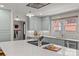 Bright kitchen featuring custom cabinets, white subway tile backsplash, and a large center island at 2112 Shenandoah Ave, Charlotte, NC 28205